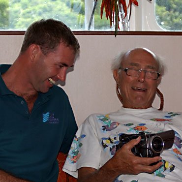 Graham on left having after dive giggles with Stan Waterman